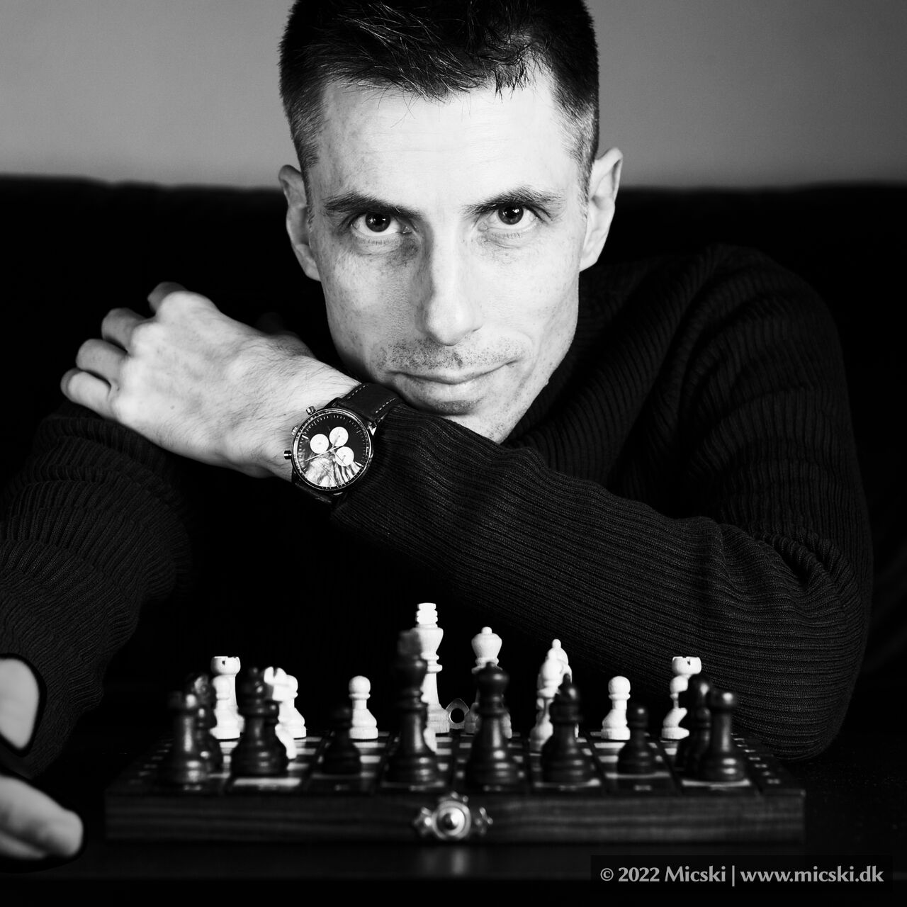 Self portrait photoshoot with chess theme in noir style.